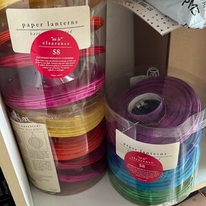 Four sets of four paper lanterns.
